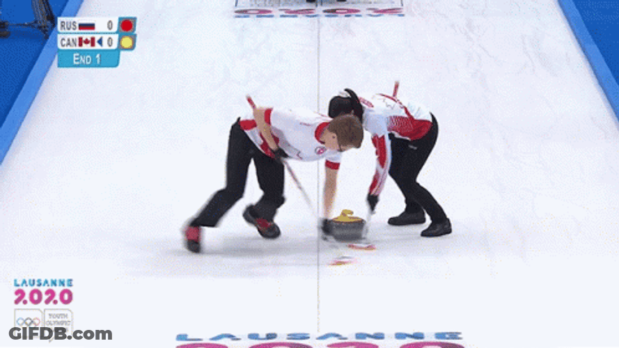 Two Athletes Sweeping Curling Stone GIF