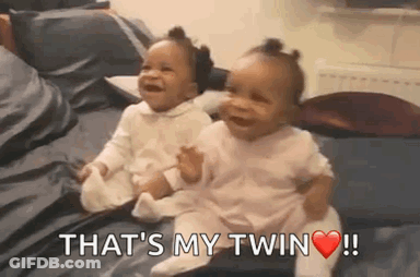 Two Baby Girls Sitting And Laughing GIF