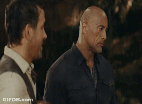 Two Bald Men Are Standing Next To Each Other GIF