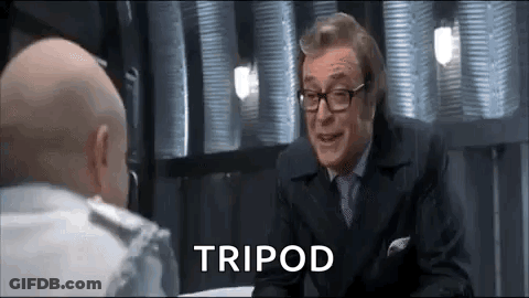 Two Bald Men In Suits Talking GIF