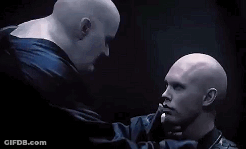Two Bald Men Kissing In Dark Room GIF