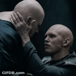 Two Bald Men One Holding Other's Neck GIF