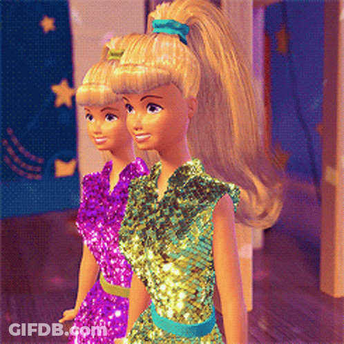 Two Barbie Dolls Are Standing Next To Each Other Wearing Different Dresses GIF