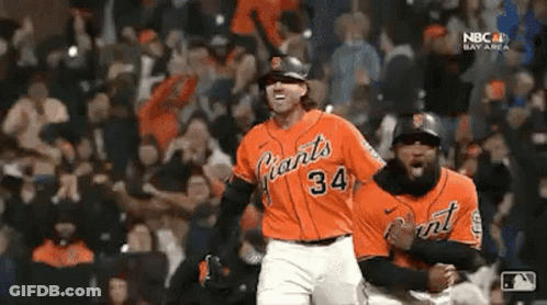 Two Baseball Players Celebrating In Orange Giants Jerseys GIF