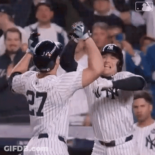 Two Baseball Players High Five On Field GIF