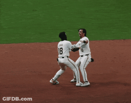 Two Baseball Players Hugging Number 7 GIF