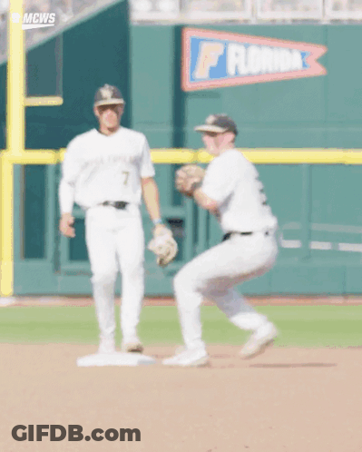 Two Baseball Players In Front Of Florida Banner GIF