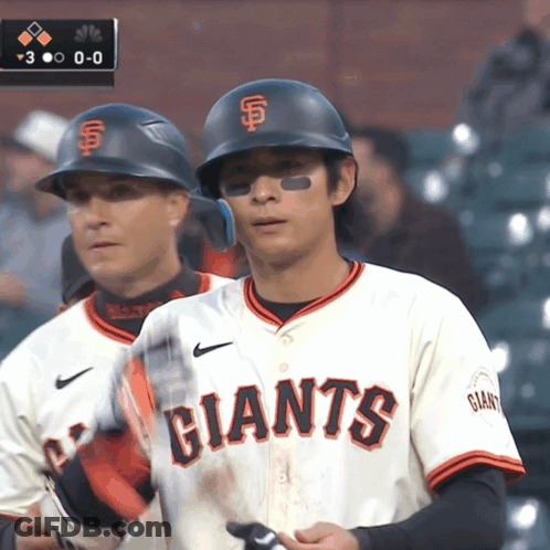 Two Baseball Players In Giants Uniforms GIF