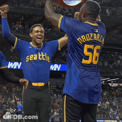 Two Baseball Players In Seattle Jerseys Celebrating GIF