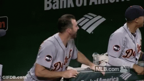 Two Baseball Players Sitting In Front Of Bank Of America Logo GIF