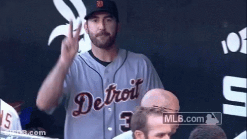 Two Baseball Players Sitting In Front Of Bank Of America Logo GIF