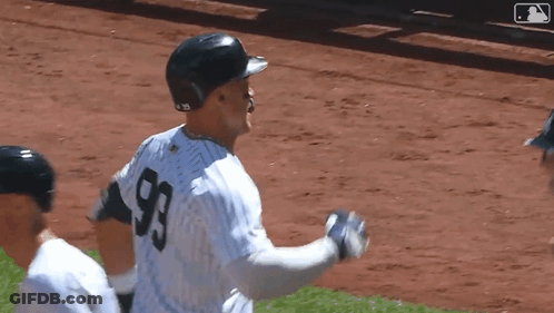 Two Baseball Players Standing Next To Each Other GIF