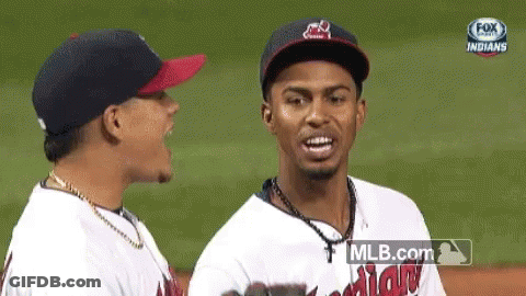 Two Baseball Players Standing On Field GIF