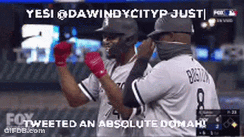 Two Baseball Players Standing On Field GIF