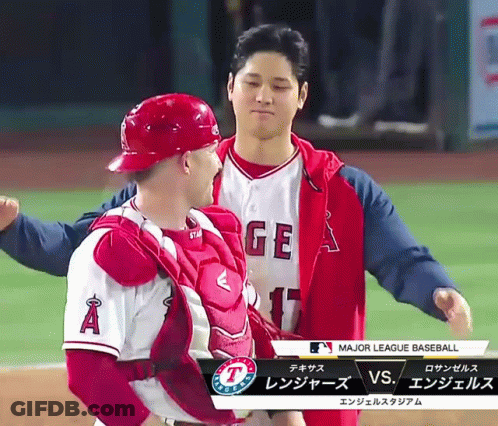 Two Baseball Players With A And GE On Shirts GIF