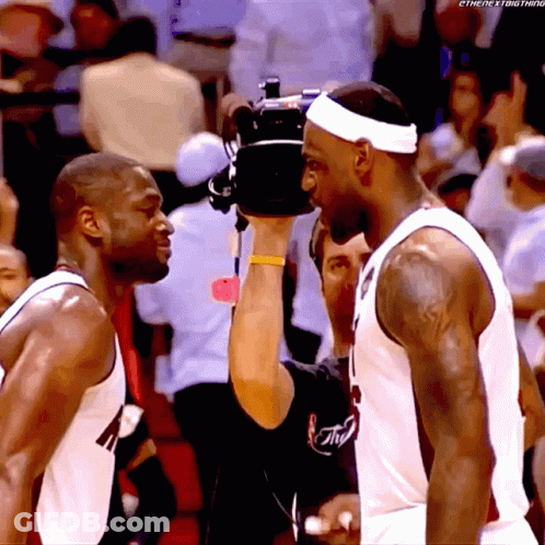 Two Basketball Players And Cameraman Taking Picture GIF