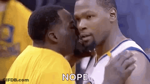 Two Basketball Players Are Kissing Each Other During A Game . GIF
