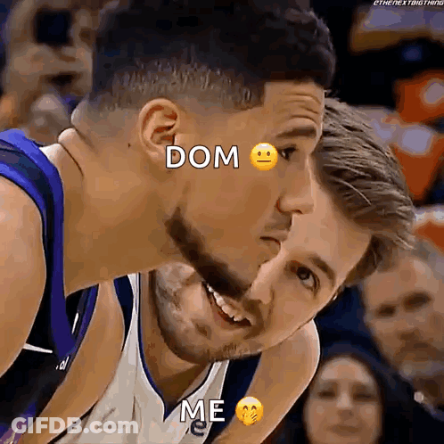 Two Basketball Players Are Looking At Each Other With A Smiley Face On Their Face . GIF