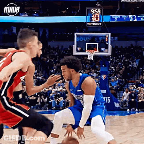 Two Basketball Players Are Playing A Game And One Has The Number 75 On His Shirt GIF