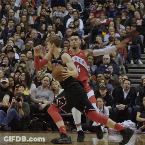 Two Basketball Players Are Playing A Game In Front Of A Crowd And One Of Them Has The Number 4 On His Jersey GIF