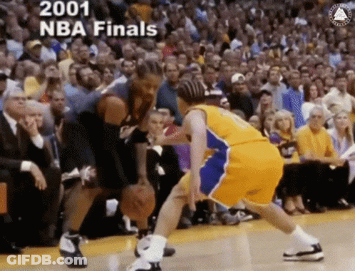 Two Basketball Players Are Playing A Game In Front Of A Crowd And The Words 2001 Nba Finals Are On The Bottom GIF