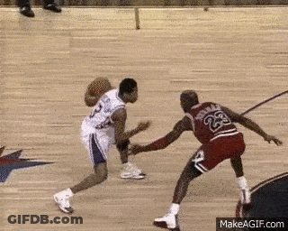 Two Basketball Players Are Playing A Game Of Basketball And One Of Them Has The Number 23 On His Back GIF