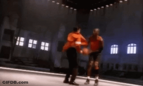 Two Basketball Players Are Playing A Game Of Basketball On A Court GIF
