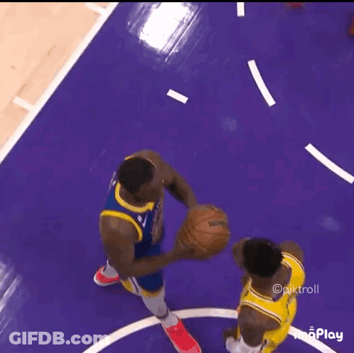 Two Basketball Players Are Playing A Game Of Basketball On A Purple Court GIF