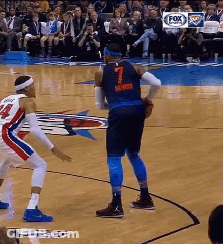 Two Basketball Players Are Playing A Game On A Court . One Of The Players Has The Number 7 On His Jersey . GIF