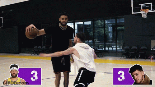 Two Basketball Players Are Playing On A Court With The Number 3 On The Side GIF