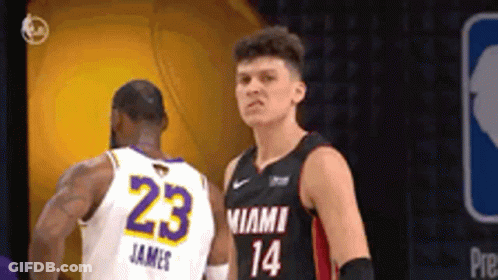 Two Basketball Players Are Standing Next To Each Other And One Of Them Has The Number 23 On His Jersey GIF