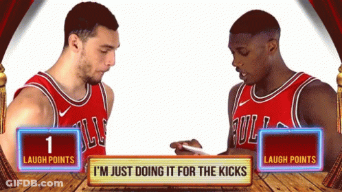 Two Basketball Players Are Standing Next To Each Other With A Sign That Says " Laugh Points " GIF