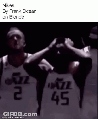 Two Basketball Players Are Standing Next To Each Other With Their Hands On Their Heads . GIF