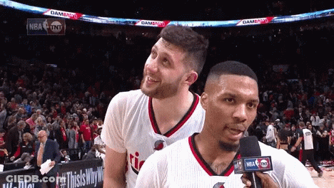 Two NBA Players Talking Into Microphone GIF