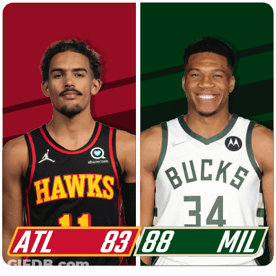 Two Basketball Players From The Hawks And The Bucks Are Standing Next To Each Other GIF