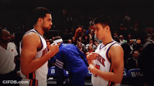 Two Basketball Players From The New York Knicks Standing Next To Each Other GIF