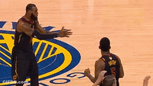 Two Basketball Players Hugging On Court GIF