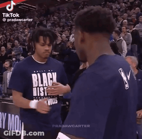 Two Basketball Players In Front Of Crowd GIF