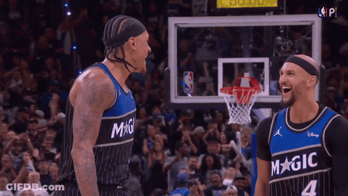 Two Basketball Players Laughing In Magic Jerseys GIF