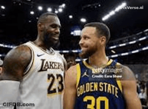 Two Basketball Players , Lebron James And Stephen Curry , Are Standing Next To Each Other And Smiling . GIF
