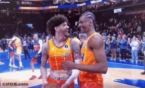 Two Basketball Players On A Court With One Wearing A Jersey That Says Latte GIF
