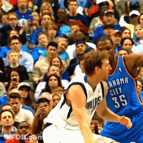 Two Basketball Players One Wearing A Dallas Jersey And One Wearing A Oklahoma City Jersey GIF