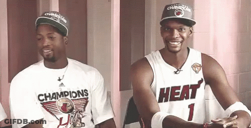 Two Basketball Players One Wearing A Heat Jersey GIF