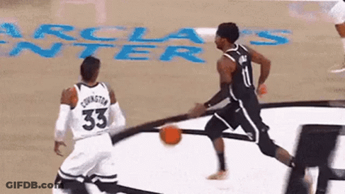 Two Basketball Players Playing Game One Wearing Number 33 Jersey GIF