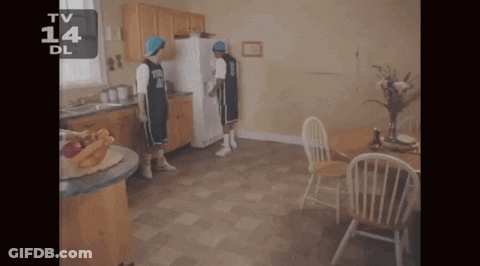 Two Basketball Players Standing In A Kitchen With The Number 14 On The Bottom Left GIF