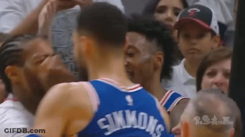 Two Basketball Players Standing In Front Of Crowd GIF