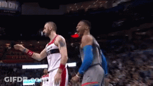 Two Basketball Players Standing In Stadium With Bud City Sign GIF