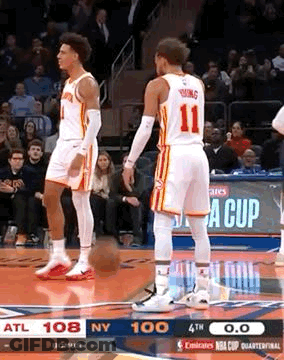 Two Basketball Players Standing On Court GIF