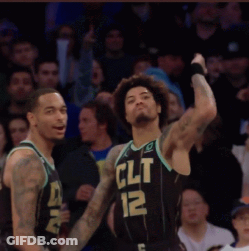 Two Basketball Players Wearing Black Jerseys That Say Clt GIF