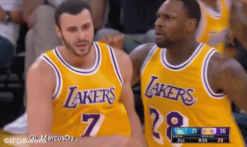 Two Basketball Players Wearing Lakers Jerseys Are Talking To Each Other GIF